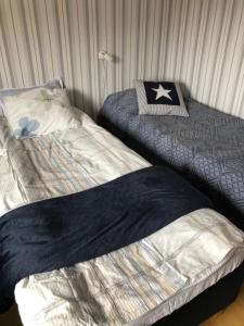 Säng eller sängar i ett rum på Galärvägen 4 A