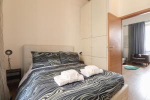 Posteľ alebo postele v izbe v ubytovaní HT RomeForAll