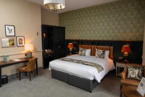 a bedroom with a bed and a desk and a chair at Himley House by Chef & Brewer Collection in Himley +51 photos