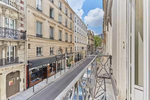 a view from a window of a street with buildings at Apartement Place Vendome by Studioprestige in Paris