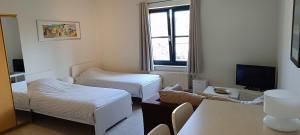 Ein Bett oder Betten in einem Zimmer der Unterkunft 1 2 (Want To) Stay - Furnished business apartments