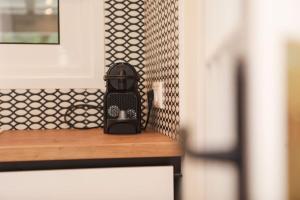 a toaster sitting on a counter in a kitchen at Venetian Canvas Retreat in Corfu +38 photos