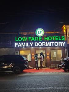 a low fare hotels family bathroom sign on a building at LOWFARE HOTELS in Kozhikode