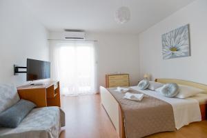 Postel nebo postele na pokoji v ubytování Apartments Rudi