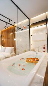 a bathroom with a bath tub in a room at Mini luxury suites by Sea&theCity in Thessaloniki