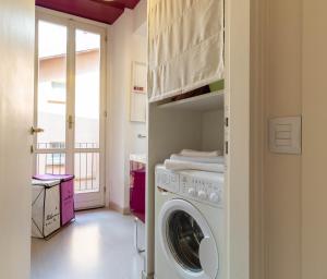 a laundry room with a washer and dryer at Lovely Home Apartment in Lecco