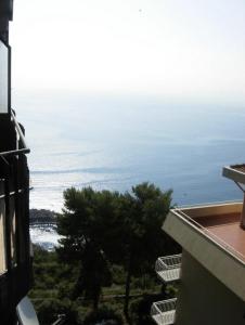 a view of the ocean from a building at Attico in città con terrazza vista etna mare in Acireale