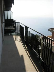 a balcony of a house with a view of the ocean at Attico in città con terrazza vista etna mare in Acireale