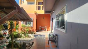 a balcony of a building with a table and chairs at Sarin Guesthouse สาริน in Koh Tao