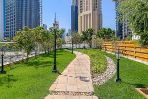 a walkway in a park in a city at Frank Porter - Mon Reve in Dubai