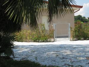 a house with a gate in front of it at Il Tarassaco-exclusive pool in Santa Maria a Monte