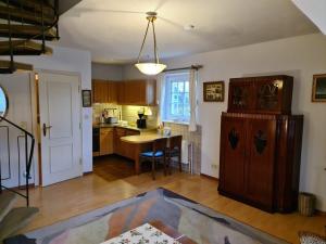 a kitchen with a table and a dining room at Hochstieg Whg8 in Nieblum