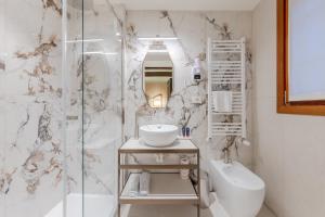 a bathroom with a shower and a sink and a toilet at 312 Piazza San Marco in Venice