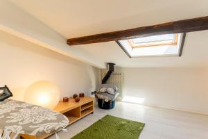 Кровать или кровати в номере Casa Ginevra - 3 Minutes Walk from the Sea