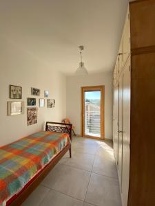 a bedroom with a bed and a window at APPARTAMENTO BEACH HOLIDAY in Fano
