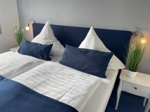 Postel nebo postele na pokoji v ubytování Hotel KAUP