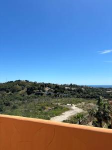 a view from a balcony of a view of a field at Ruim Penthouse Elviria Marbella met groot terras in Marbella