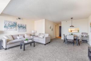 a living room with two couches and a table at 2BR Executive Apartment with Balcony in Arlington