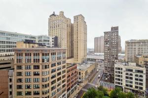 an aerial view of a city with tall buildings at 2BR Executive Downtown Apartment by ENVITAE in Detroit