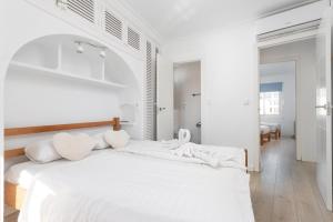 En eller flere senge i et værelse på APARTAMENTO THIERRY + 30 billeder