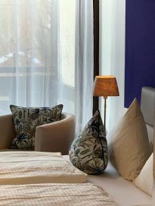 Postel nebo postele na pokoji v ubytování Hotel garni Bellevue