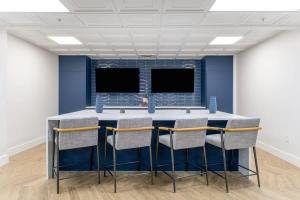 a conference room with a table and chairs at 3BR Premium Downtown Apartment with Office & Gym in Charlotte