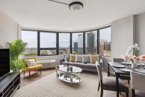 a living room with a couch and a table at 2BR Vibrant South Loop Apartment in Chicago