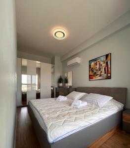 Cama o camas de una habitación en City Haven Tirana