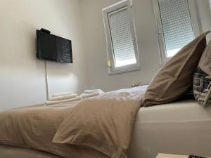 Llit o llits en una habitació de Apartman Ares