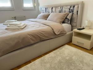Llit o llits en una habitació de Apartman Ares