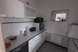 Kuchyň nebo kuchyňský kout v ubytování Appartement, parking privé, balcon
