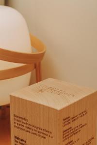 a cardboard box sitting next to a chair at Hotel Zaragoza Plaza in Donostia-San Sebastián