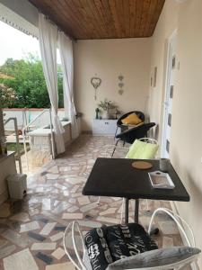 a room with a table and chairs and a floor at Seafront Apartment Jadri in Umag