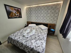Postel nebo postele na pokoji v ubytování Welcome Apartment, Nea Peramos
