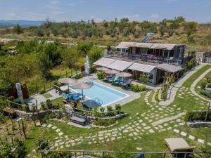 een luchtzicht op een huis met een zwembad bij Attalos Mythical Nest - Private Pool Escapade in Tsáyezi