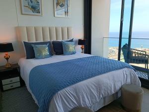 Postel nebo postele na pokoji v ubytování HOM I Frente al Mall I Confort total I Studio I Wifi PNB 1817