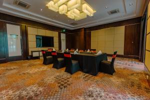 a conference room with a long table and chairs at Crowne Plaza Nairobi Airport by IHG in Nairobi