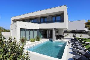 an image of a house with a swimming pool at Villa Didov San Family Residence with Pool in Zaton