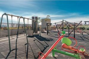 a playground with a swing set and a slide at Lujoso Loft con Mejor vista de Valparaíso, Parking Servicio HOM in Valparaíso