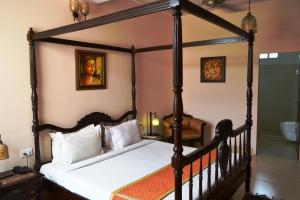 Postel nebo postele na pokoji v ubytování Suryaa Villa - A Boutique Heritage Hotel