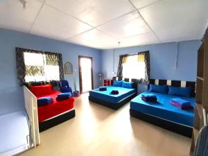 a living room with two couches and a couch at D'TERRACE KUNDASANG in Ranau