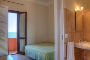 Posteľ alebo postele v izbe v ubytovaní Hotel Bue Marino
