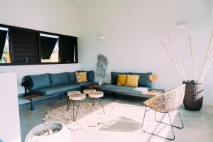 Area soggiorno di Bohemi Design Villa's
