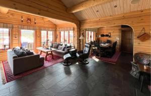 a living room filled with furniture and a dining room at Cozy Home In Trysil With Wifi in Trysil