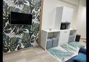 a living room with a flat screen tv on a wall at Princess resort in Hurghada