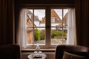 Posezení v ubytování Boutique Hotel Elburg met Tapperij