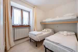 Postel nebo postele na pokoji v ubytování Residence Tatiana Dependance