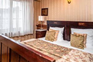 Łóżko lub łóżka w pokoju w obiekcie Apartamenty Molus na Rynku Staromiejskim