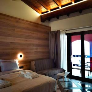 A bed or beds in a room at Z Inn Ioannina
