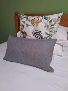 a pillow sitting on top of a bed at Fraai Maraai Self Catering Apartments in Groblersdal
